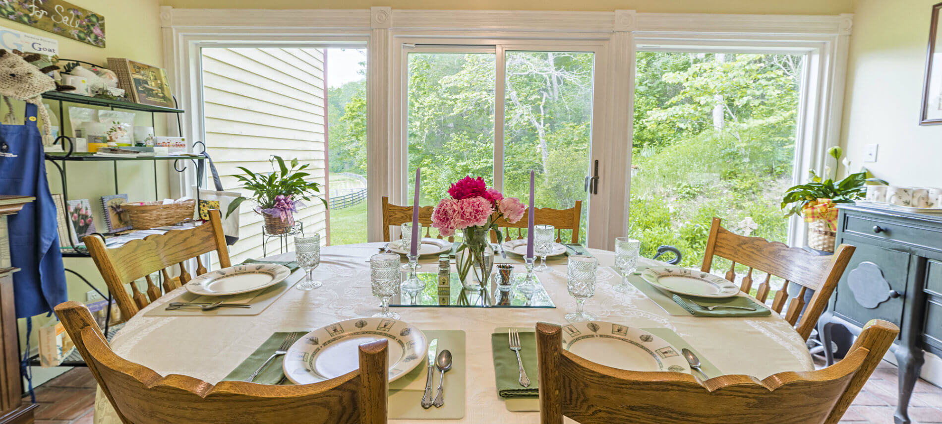 The Sunroom has a complete wall of white-framed windows so you can experience the outdoor seasons as you dine.